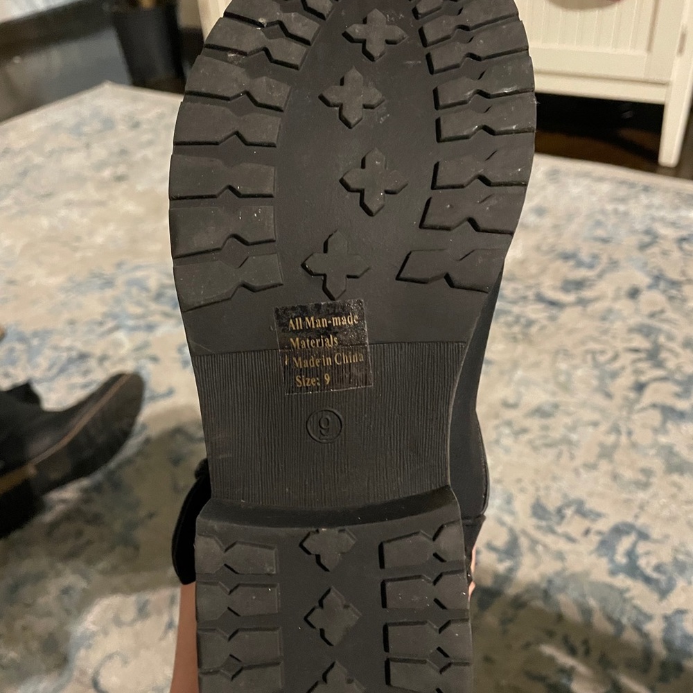 Tall (never worn) black studded boots.